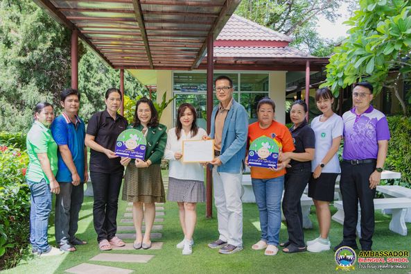 Mr. Raknarin Kaewmeesri, Director of the Public Health and Environment Division, along with FS1 Sakol Khamdee, an expert professional nurse, Public Health and Environment Division, Nong Phueng Municipality, Saraphi, have given certificates of honor to Ambassador Bilingual School on 21st June 2024
