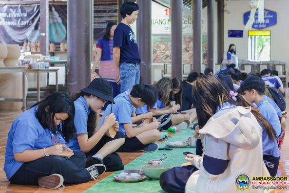 Grade 7 students explore their artistic side with a pottery and plate painting workshop at Chiangmai Celadon.